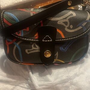 Dooney & Bourke Black Wristlet Bag with.    Multicolor pattern